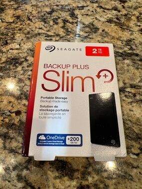 Seagate Backup Plus Slim 2TB Portable Storage - White with Red Accents
